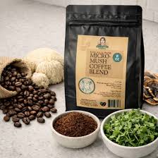 Coffee blend bag with coffee beans, ground coffee, mushrooms, and microgreens on a countertop