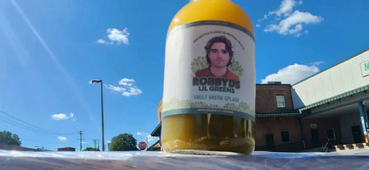 Robby Ds Sweet Green Splash organic microgreen broccoli drink bottle with green label and natural fruit flavoring