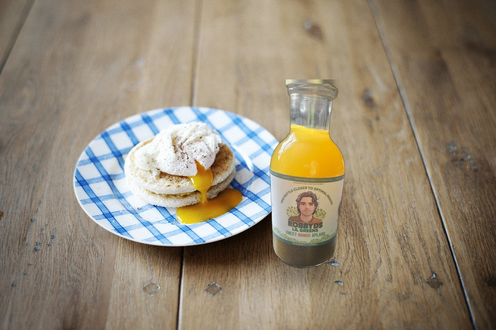 Sweet Mango Splash served with a fresh breakfast on a rustic wood table