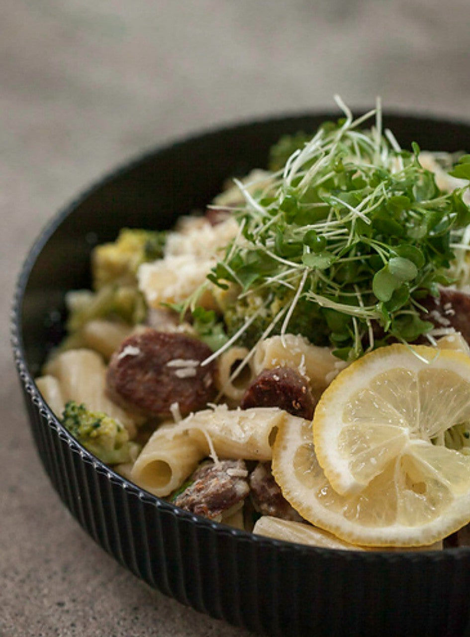 Broccoli microgreen rigatoni with lemon-ricotta sauce, topped with fresh broccoli microgreens — a serving idea using Robby Ds Lil Greens organic broccoli microgreens