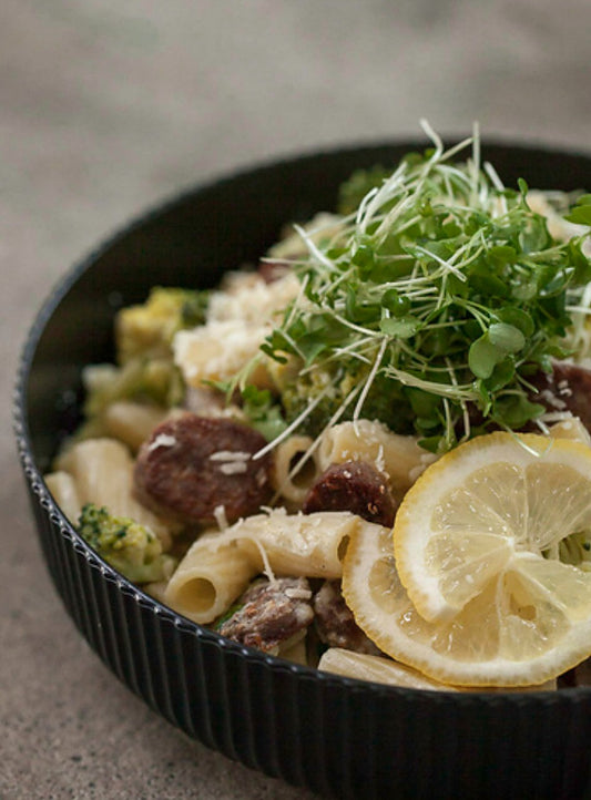 Broccoli microgreen rigatoni with lemon-ricotta sauce, topped with fresh broccoli microgreens — a serving idea using Robby Ds Lil Greens organic broccoli microgreens