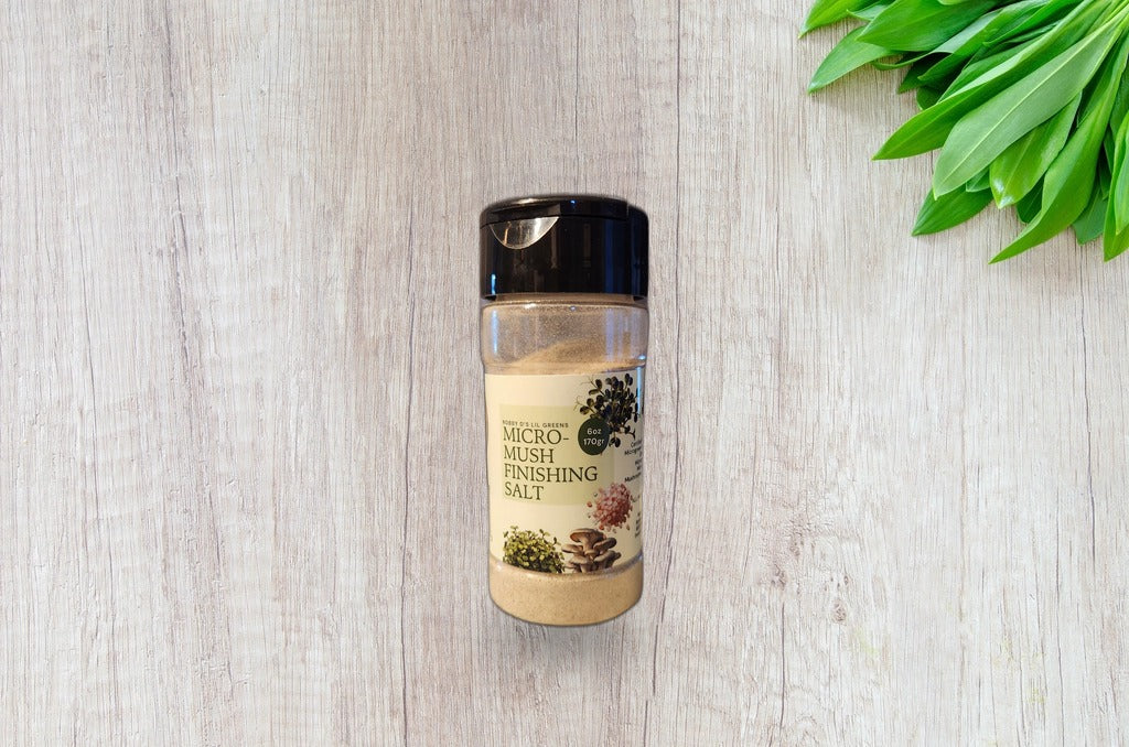 Micro-Mush microgreen mushroom finishing salt jar on a bright wood surface